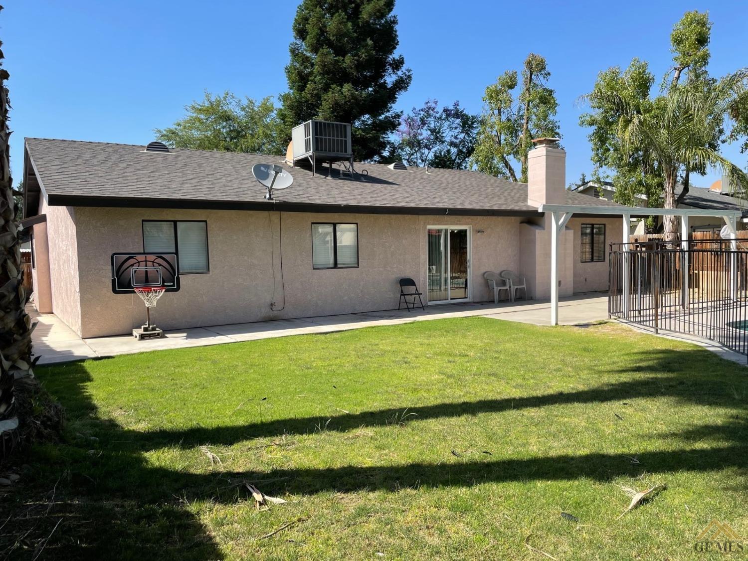 Undisclosed Address Bakersfield, CA 93311 - Photo 20 of 20 a house with trees in the background