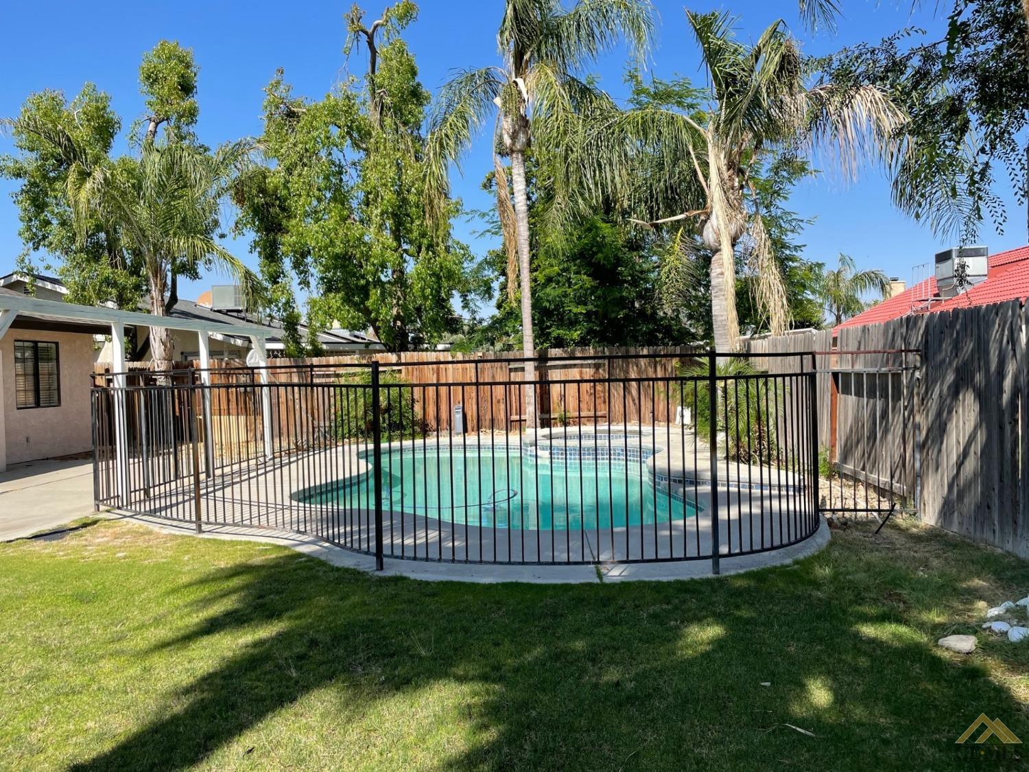 Undisclosed Address Bakersfield, CA 93311 - Photo 2 of 20 a view of a backyard with a garden