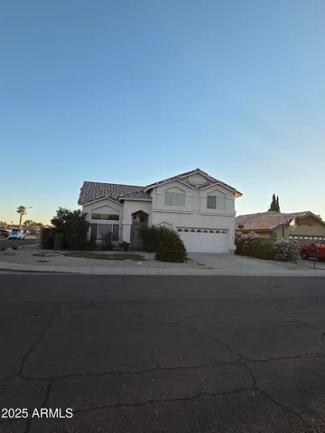 a view of a car parked in front of a house
