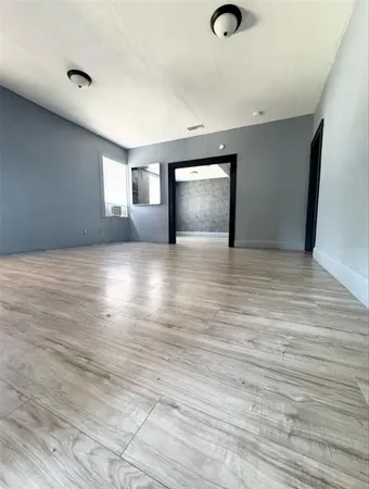 a view of an empty room and window
