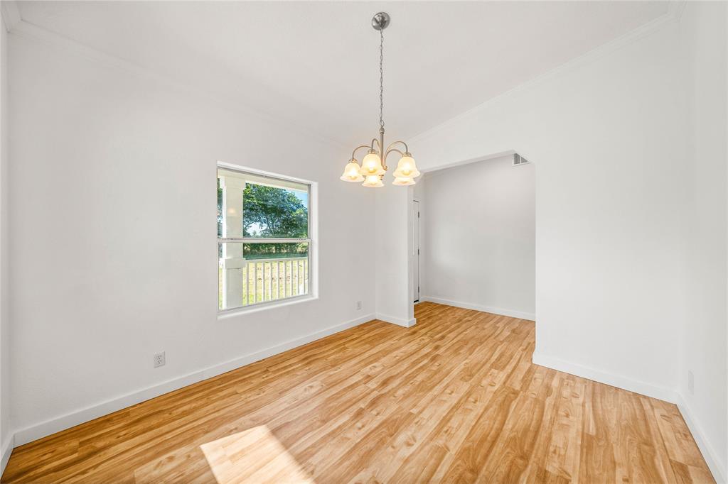 429 Eagle Ridge Road McGregor, TX 76657 - Photo 13 of 40 a bedroom with a bed and a window