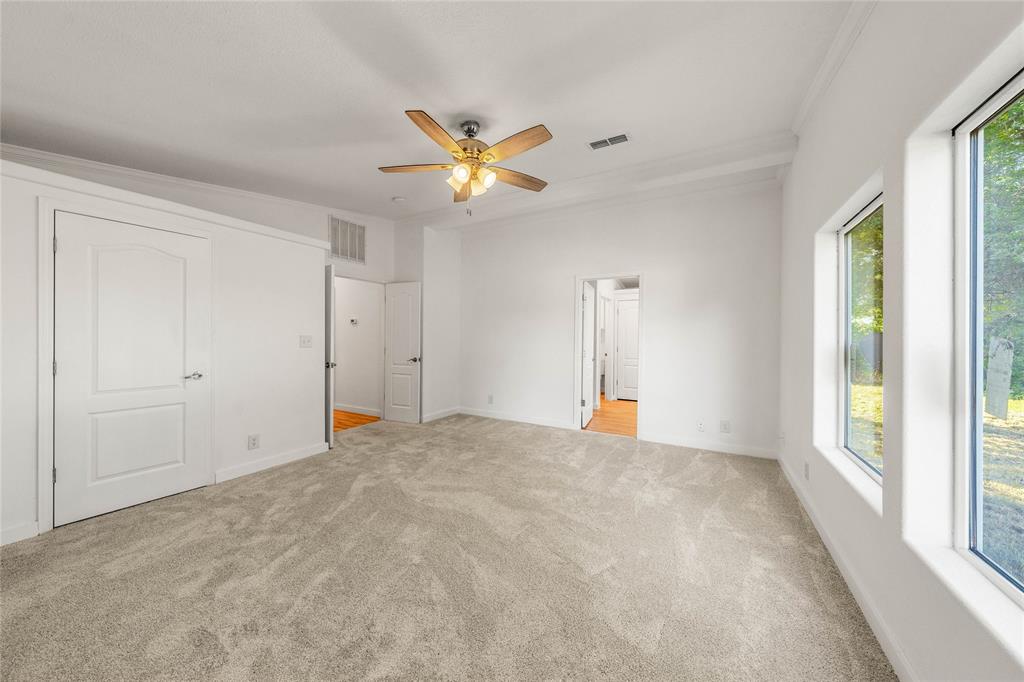 429 Eagle Ridge Road McGregor, TX 76657 - Photo 21 of 40 a view of empty room with window and ceiling fan