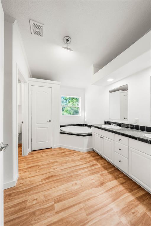 429 Eagle Ridge Road McGregor, TX 76657 - Photo 22 of 40 a view of a kitchen with wooden floor