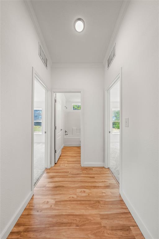 429 Eagle Ridge Road McGregor, TX 76657 - Photo 26 of 40 a view of a hallway with wooden floor and closet