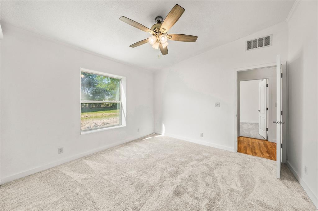429 Eagle Ridge Road McGregor, TX 76657 - Photo 28 of 40 an empty room with fan and windows