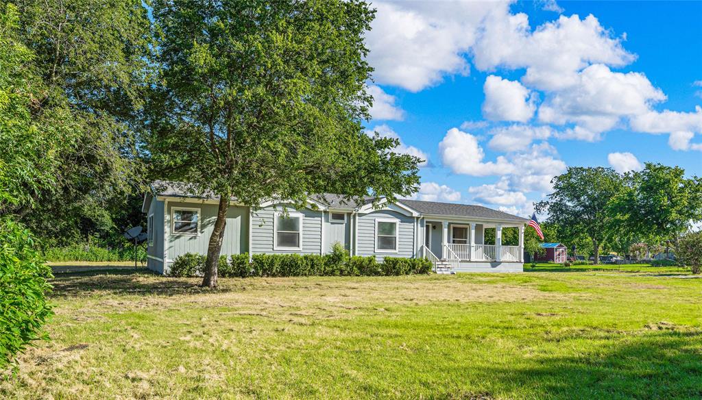 429 Eagle Ridge Road McGregor, TX 76657 - Photo 3 of 40 a front view of a house with a yard
