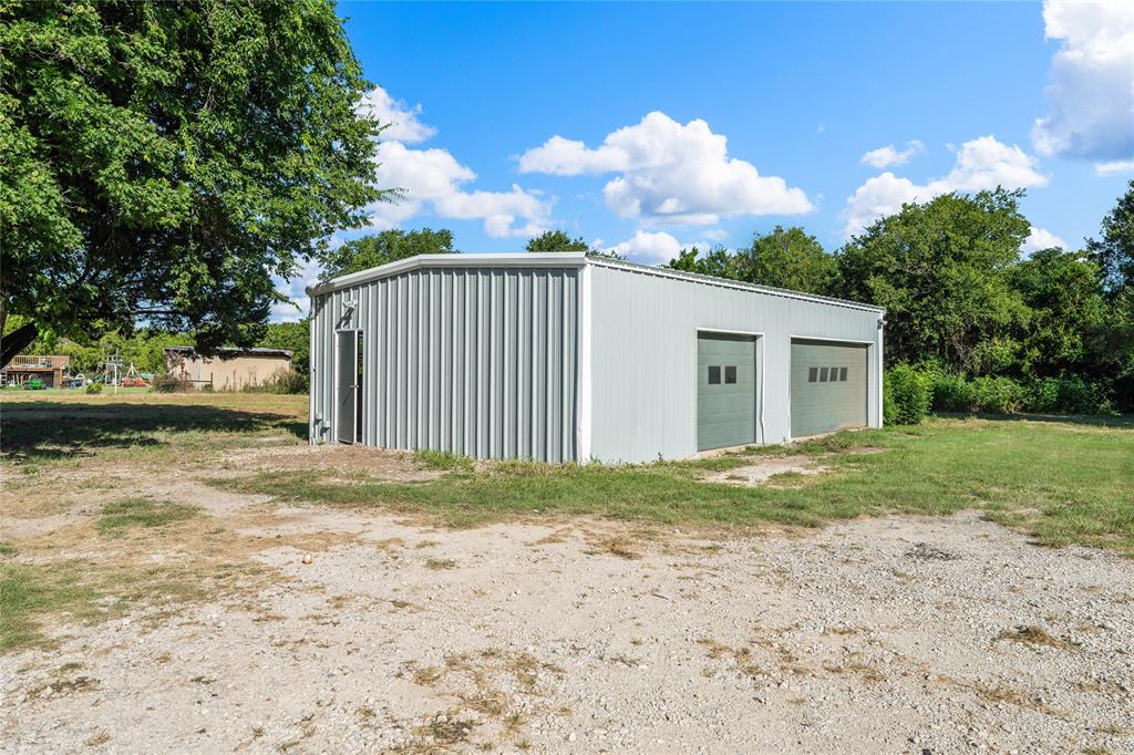 429 Eagle Ridge Road McGregor, TX 76657 - Photo 34 of 40 a view of a house with backyard and garden