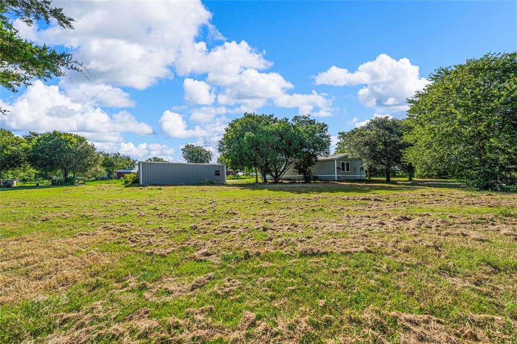 429 Eagle Ridge Road McGregor, TX 76657 - Photo 38 of 40 a view of outdoor space with swimming pool and green space