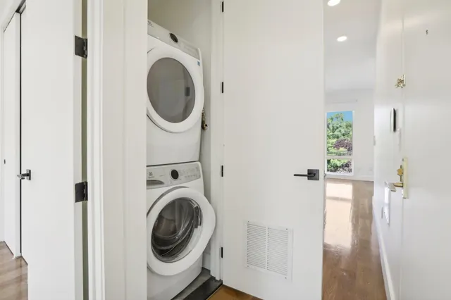 a utility room with sink dryer and washer