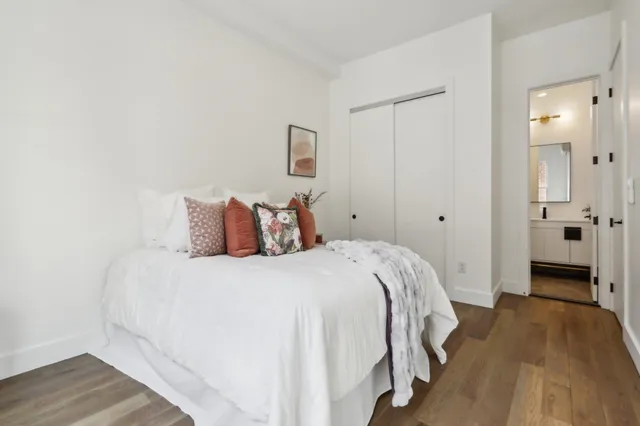 a bedroom with a bed and a walk in closet