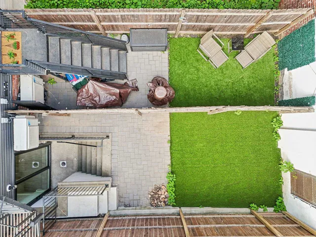 a view of a patio with table and chairs
