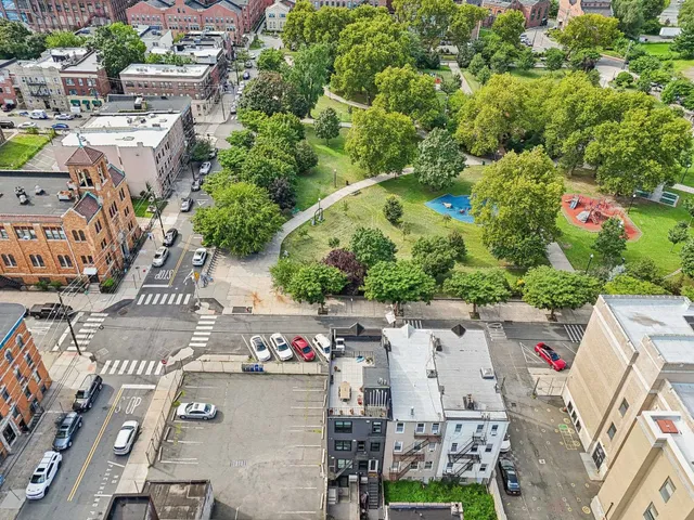 an aerial view of residential houses and outdoor space