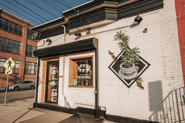 a view of a building with a couple of people seating