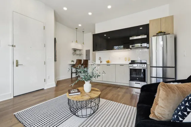 a living room with furniture and a table