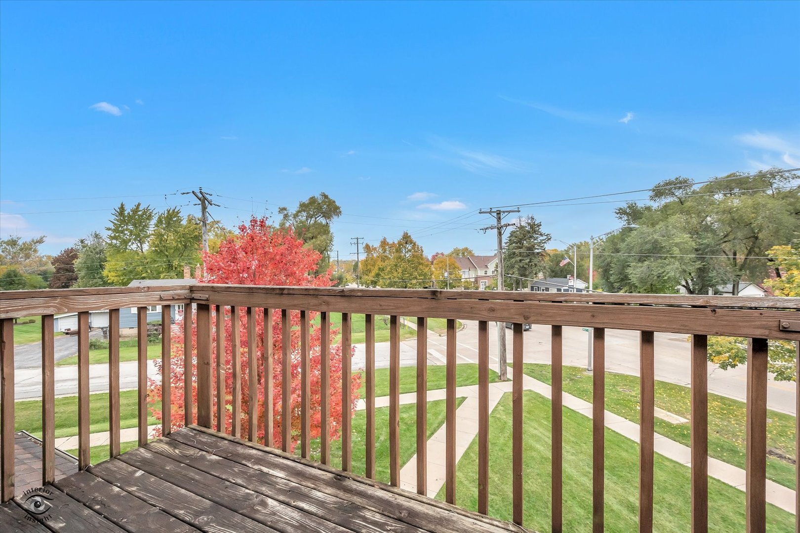19300 Wolf Road, Unit 11 Mokena, IL 60448 - Photo 4 of 22 a view of a balcony with wooden floor & fence