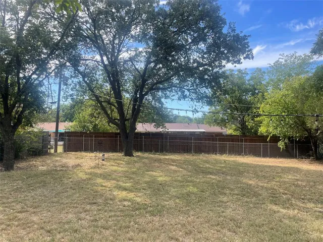 a swimming pool with wooden fence