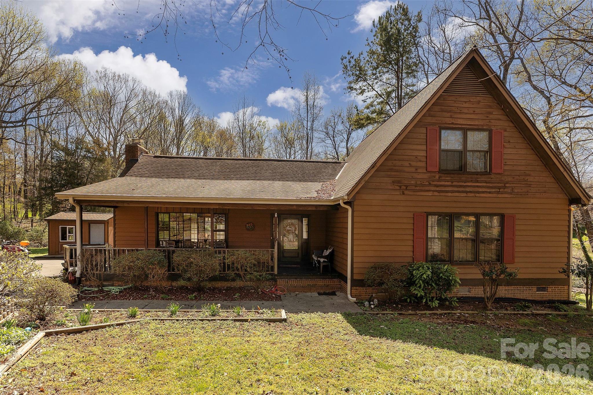 5332 Quail Ridge Drive Mint Hill, NC 28227 - Photo 1 of 22 a front view of a house with garden