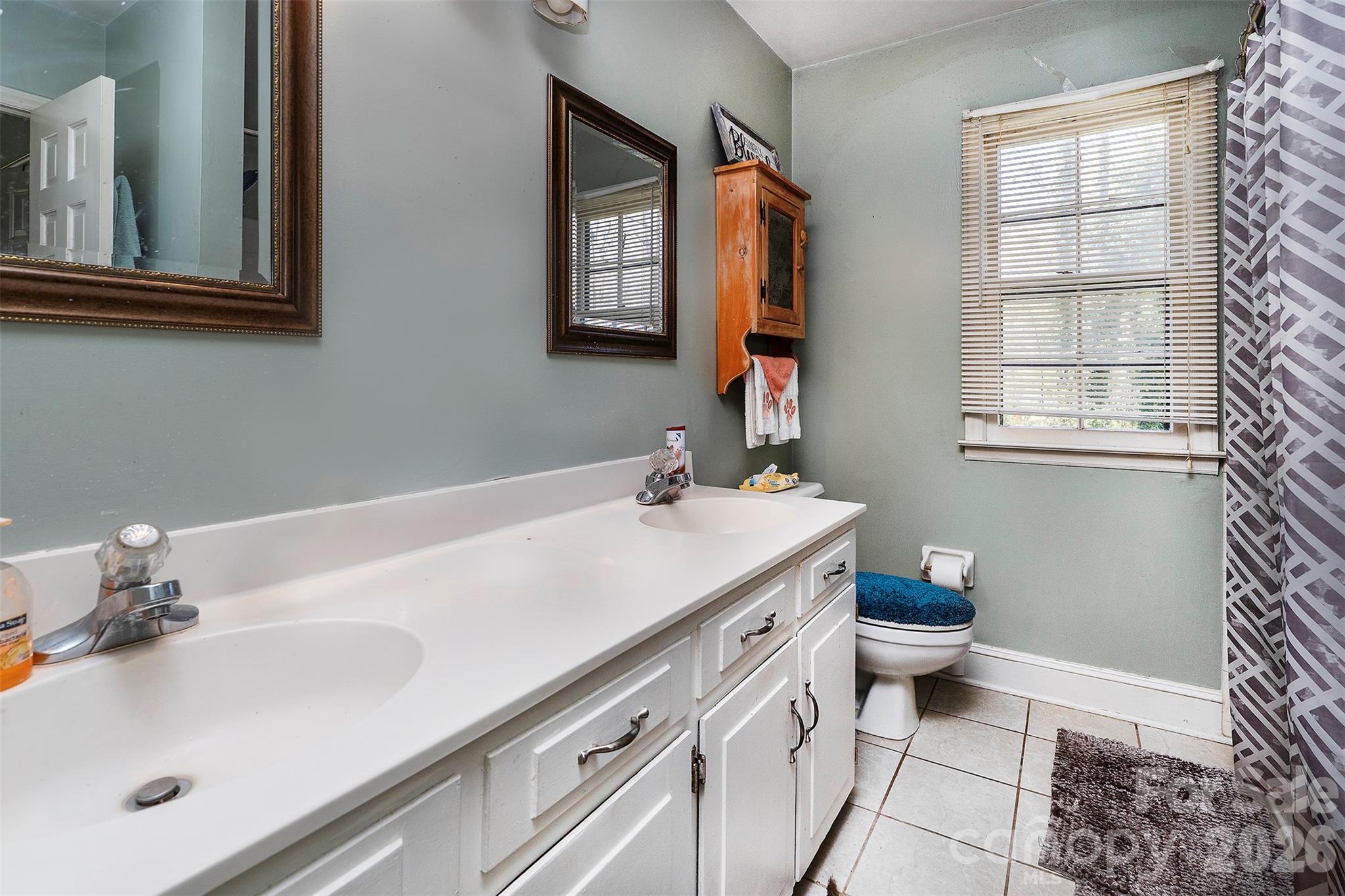5332 Quail Ridge Drive Mint Hill, NC 28227 - Photo 12 of 22 a bathroom with a sink and a mirror