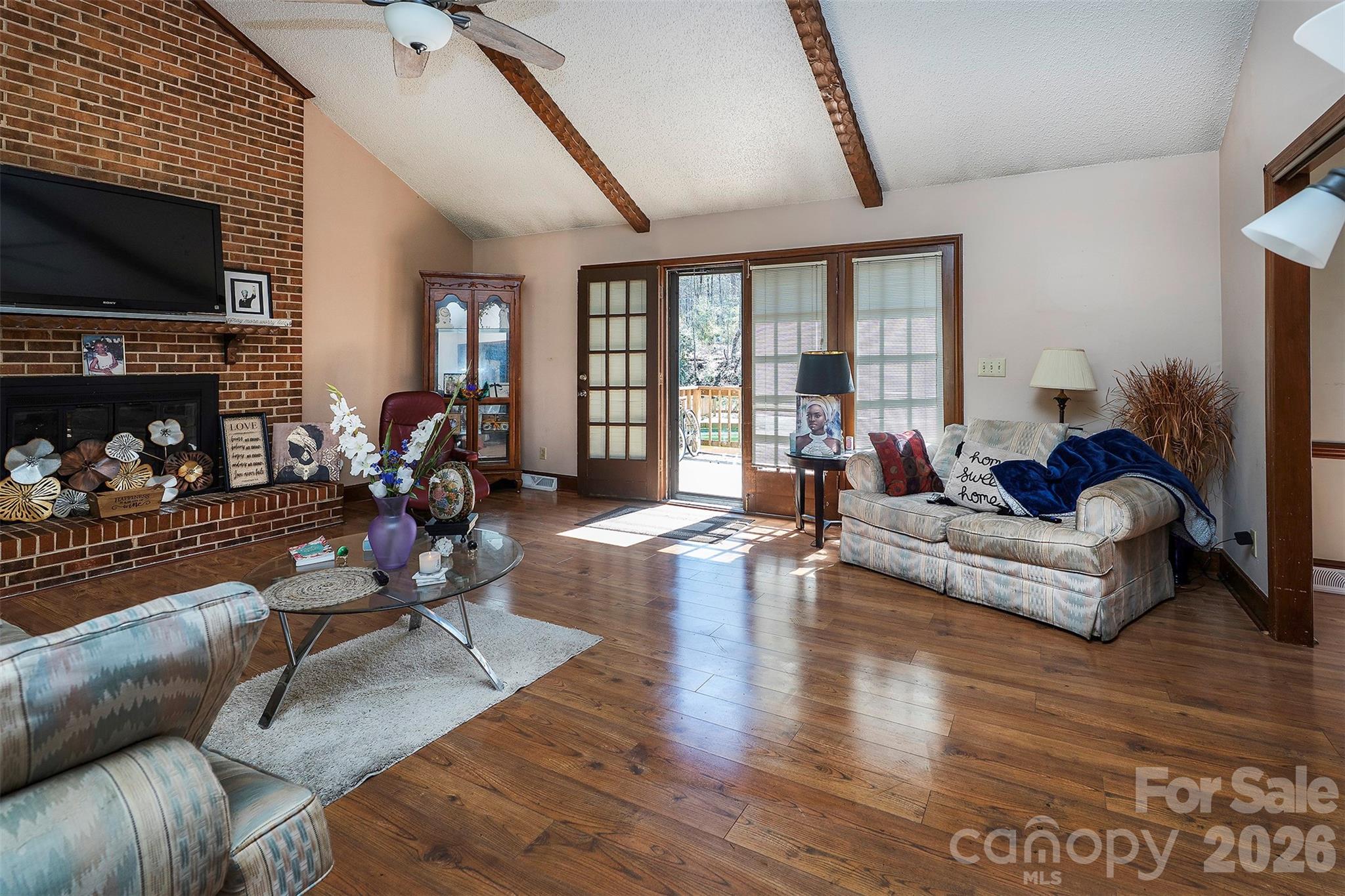 5332 Quail Ridge Drive Mint Hill, NC 28227 - Photo 6 of 22 a living room with fireplace furniture and a flat screen tv