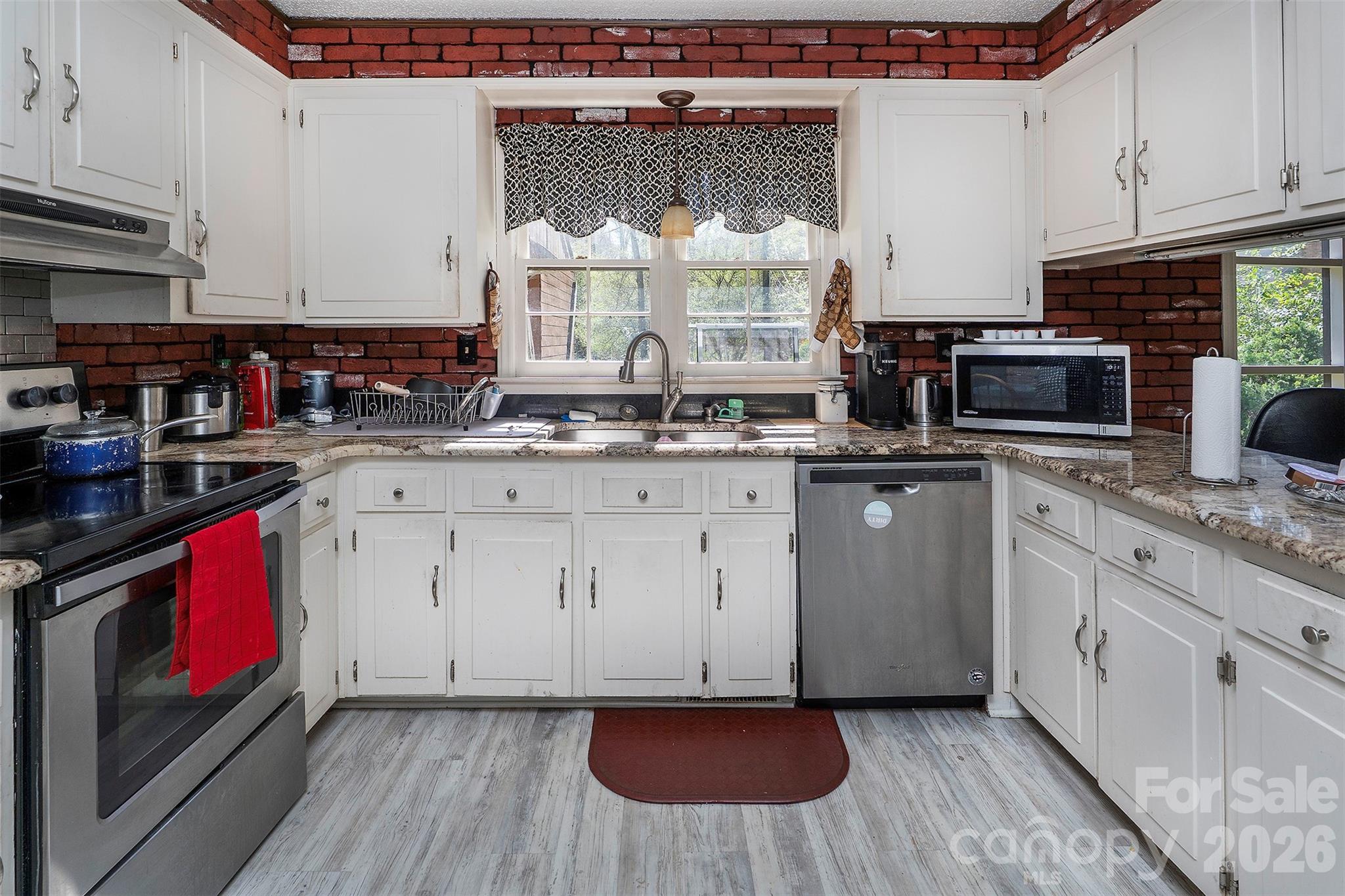 5332 Quail Ridge Drive Mint Hill, NC 28227 - Photo 7 of 22 a kitchen with a sink stove and cabinets