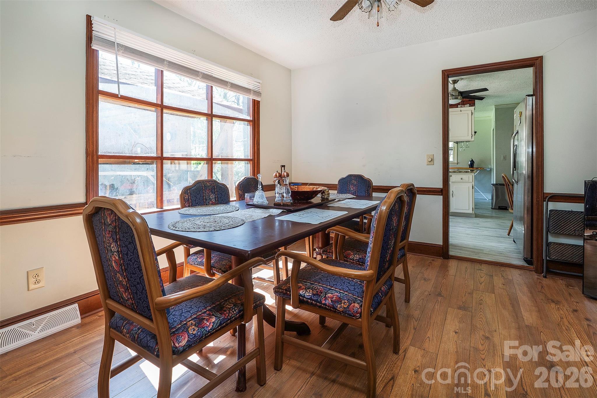5332 Quail Ridge Drive Mint Hill, NC 28227 - Photo 8 of 22 a view of a dining room with furniture and wooden floor