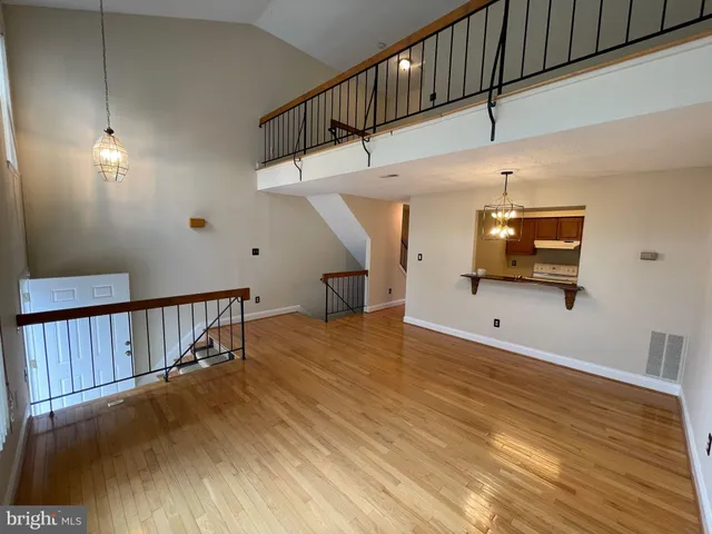 a view of a hallway with stairs