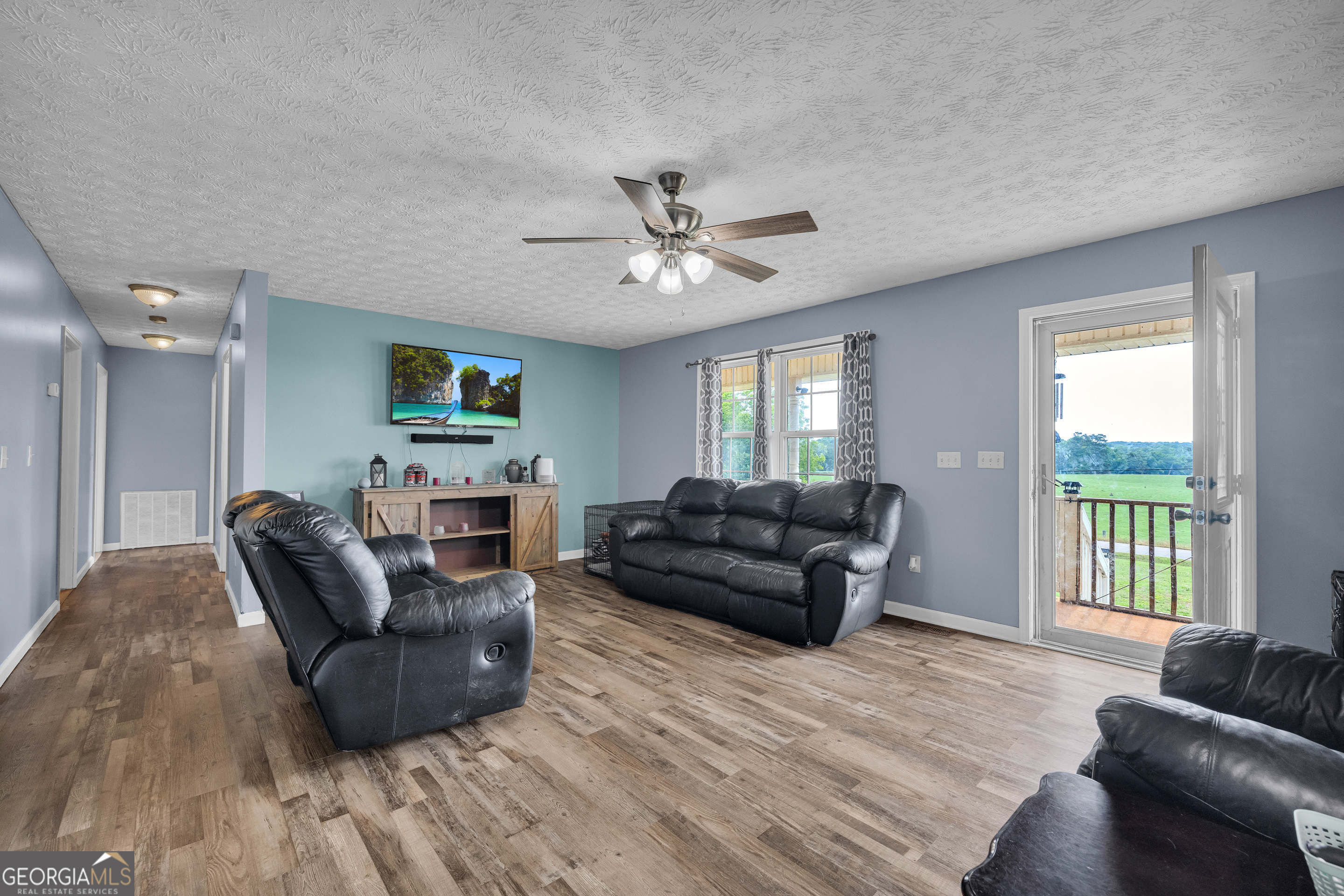 156 Shirley Road Royston, GA 30662 - Photo 5 of 29 a living room with furniture and a large window