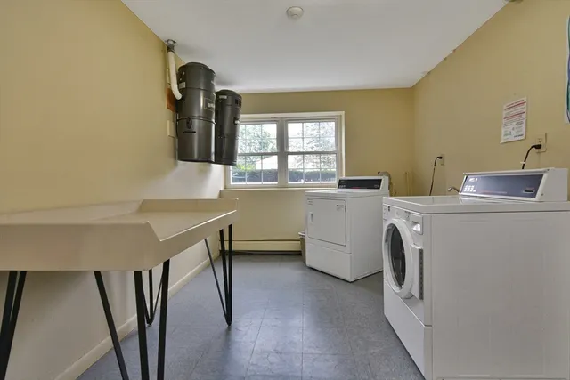 a view of kitchen and utility room with washer and dryer