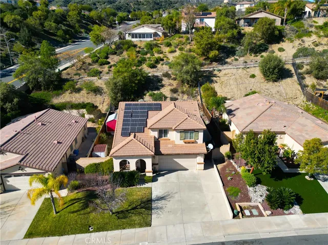 an aerial view of residential houses with outdoor space