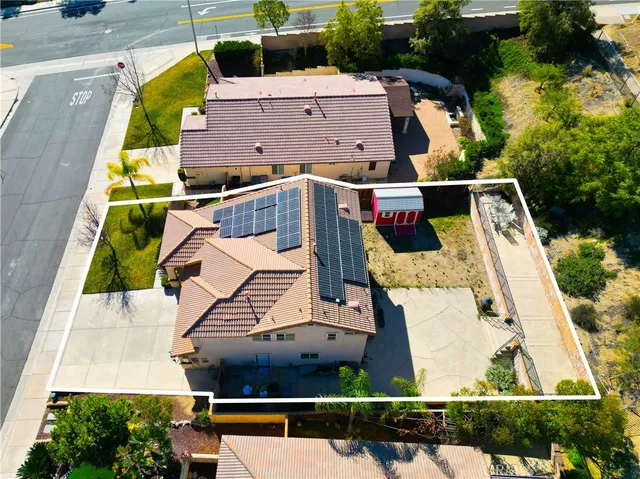 an aerial view of a house with swimming pool