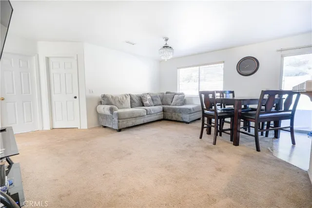 a kitchen with refrigerator and cabinets