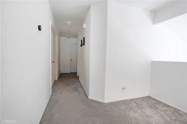 a view of a room with a hallway