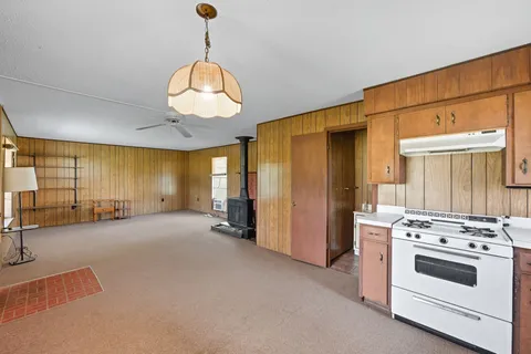 a view of a kitchen with a sink and a stove