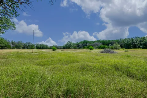 a view of a building and a yard