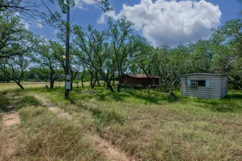 a view of outdoor space with deck and yard