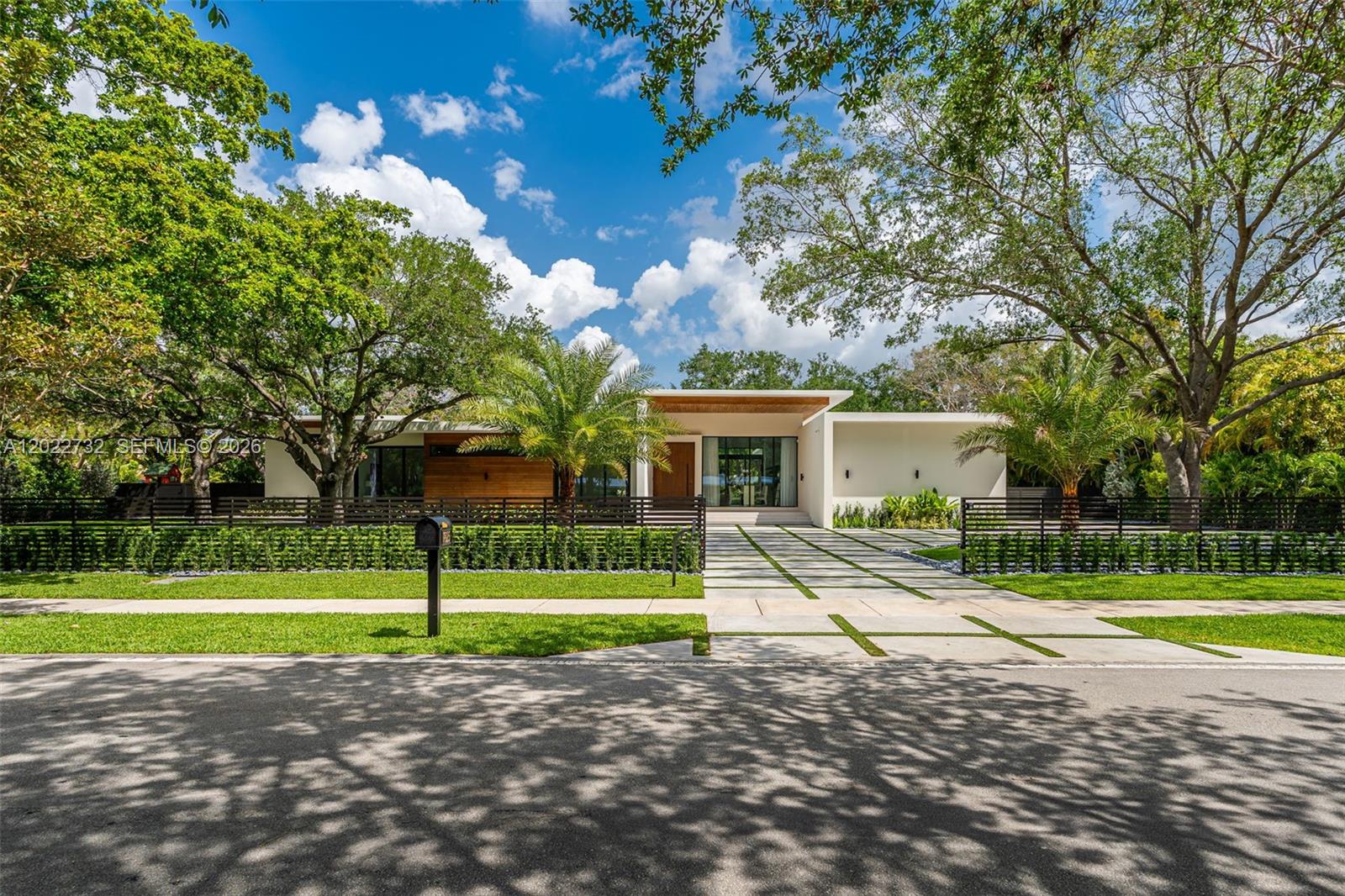 7825 Southwest 128th Street Pinecrest, FL 33156 - Photo 2 of 88 a view of a house with a yard and a large tree