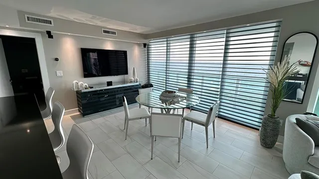 a living room with furniture window and wooden floor