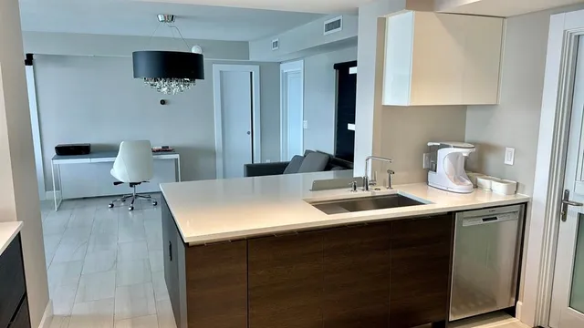 a en suite bathroom with a sink and mirror