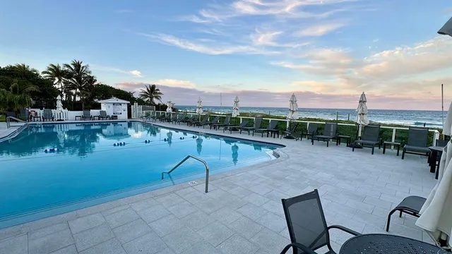 a view of a lake with sitting space