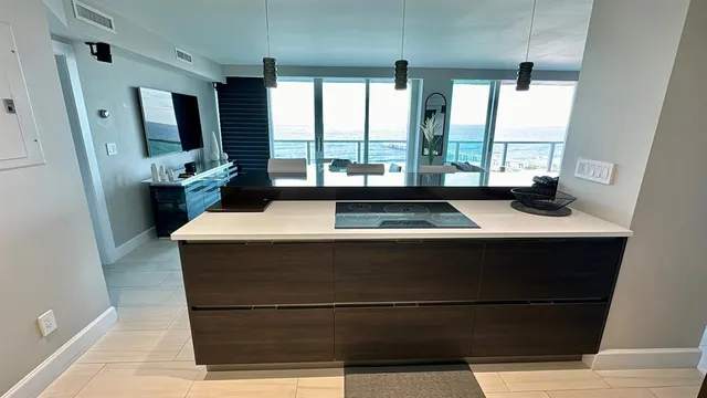 a view of living room with furniture and large window