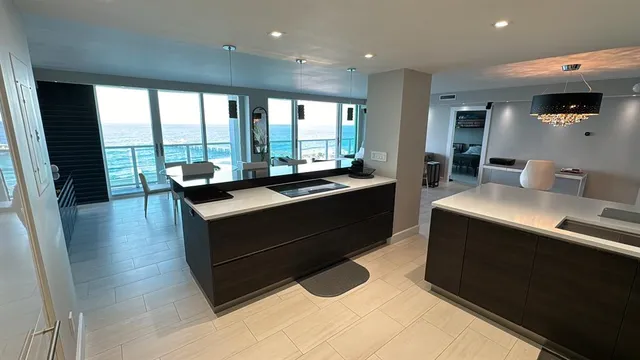 a view of kitchen with a sink and wooden floor