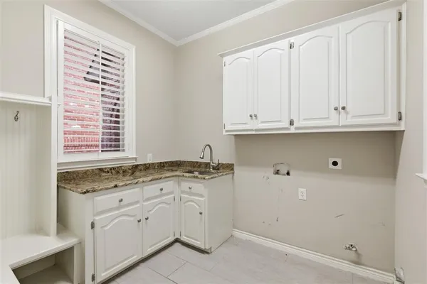 a view of cabinets with granite countertop white cabinets