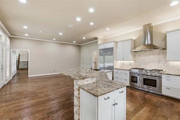 a kitchen with a stove and a kitchen island