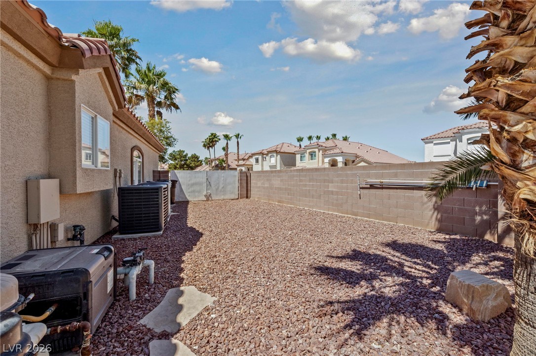 740 Aldo Rae Court, Unit NONE Henderson, NV 89052 - Photo 32 of 35 A spacious, rock-covered backyard provides a low-maintenance outdoor retreat.