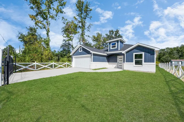 a front view of a house with yard