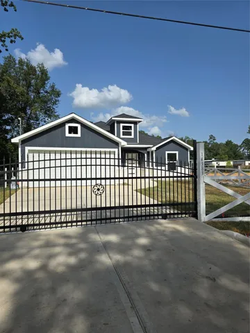 a front view of a house with a fence