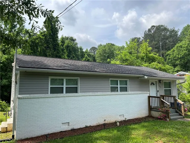 a house with garden in front of it