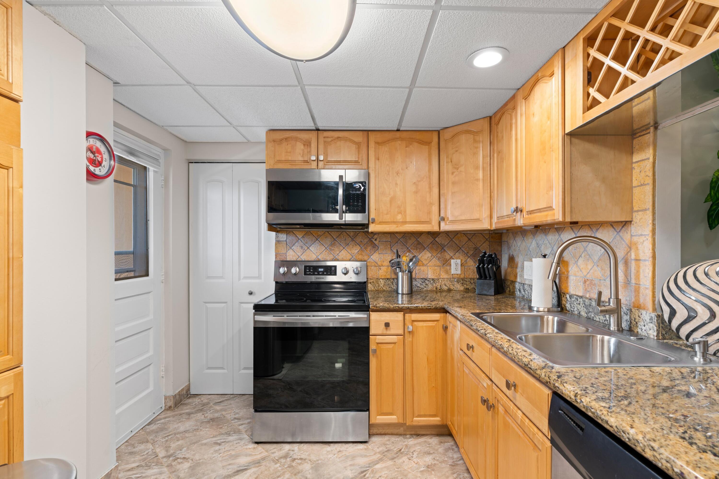 6461 Northwest 2nd Avenue, Unit 415 Boca Raton, FL 33487 - Photo 9 of 25 Laundry Room Behind Closed Door
