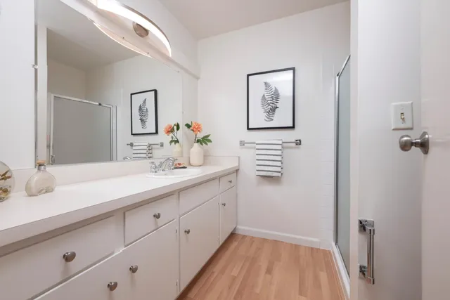 a bathroom with a sink and mirror