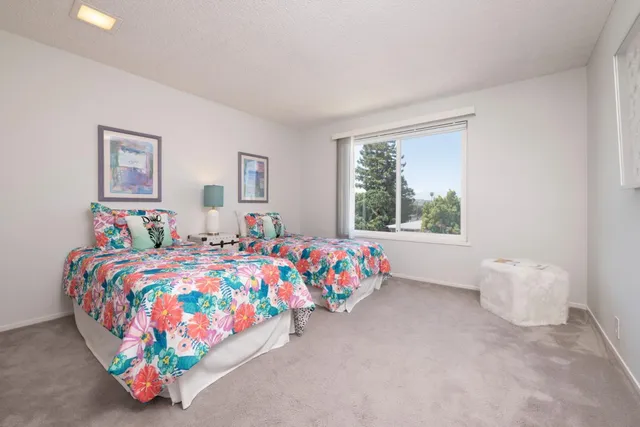 a bedroom with bed and a window